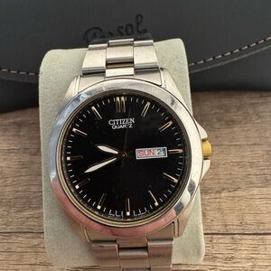 Citizen Black, Gold and Silver Watch with Day/Date Display